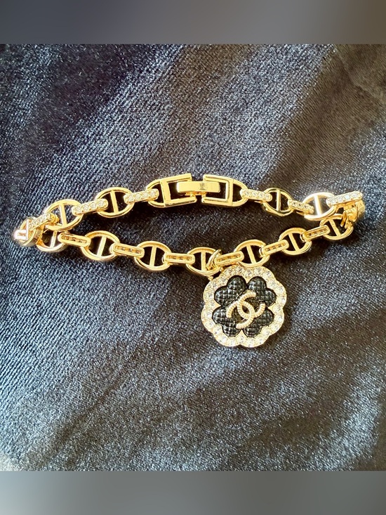 CHANEL Jewelry - Gold-Tone Pig 🐽 Nose Link Bracelet with Black CHANEL Camellia Charm